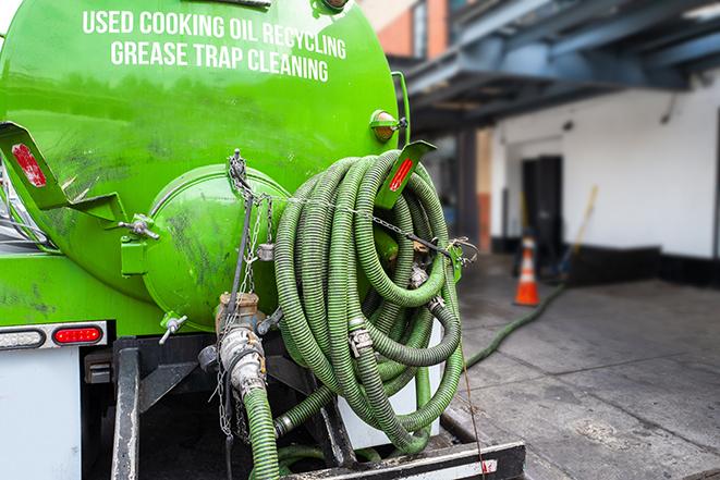 a large industrial grease trap being pumped out in Clyde Hill, WA